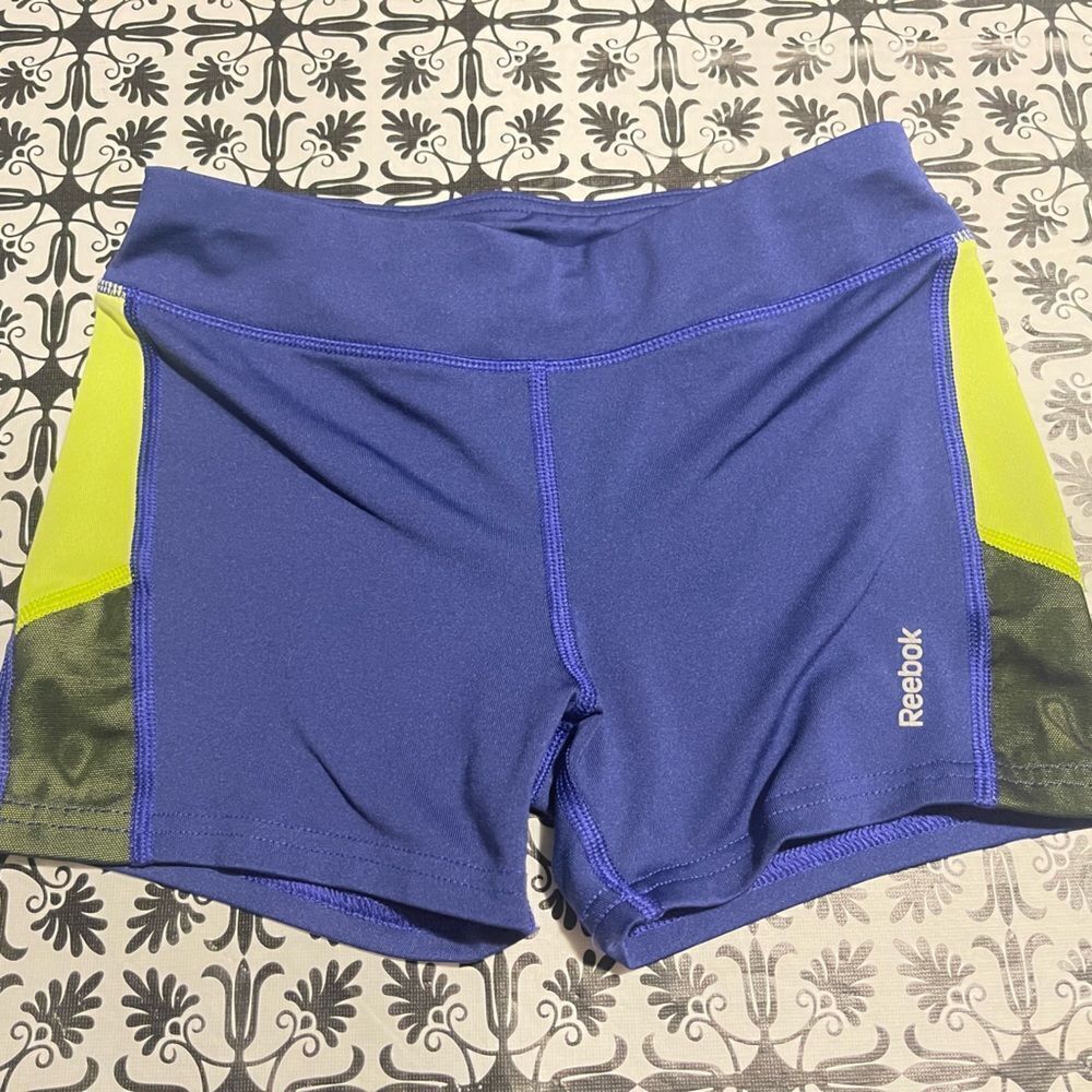 Reebok
- Girls purple / neon yellow spandex shorts